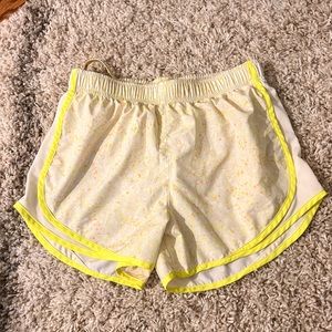 Nike athletic shorts, yellow and white , speckled print, size Small